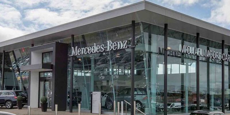 Michael Moore Mercedes Benz forecourt